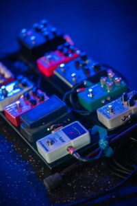 Guitar effects pedals on a performance stage. 